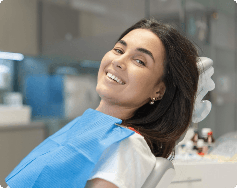 Smiling patient in a dental chair