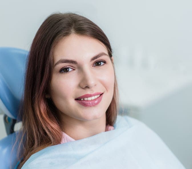 Smiling woman in the dental chair